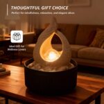 Night view of Amazon Basics Tabletop Fountain showing the glowing LED effect