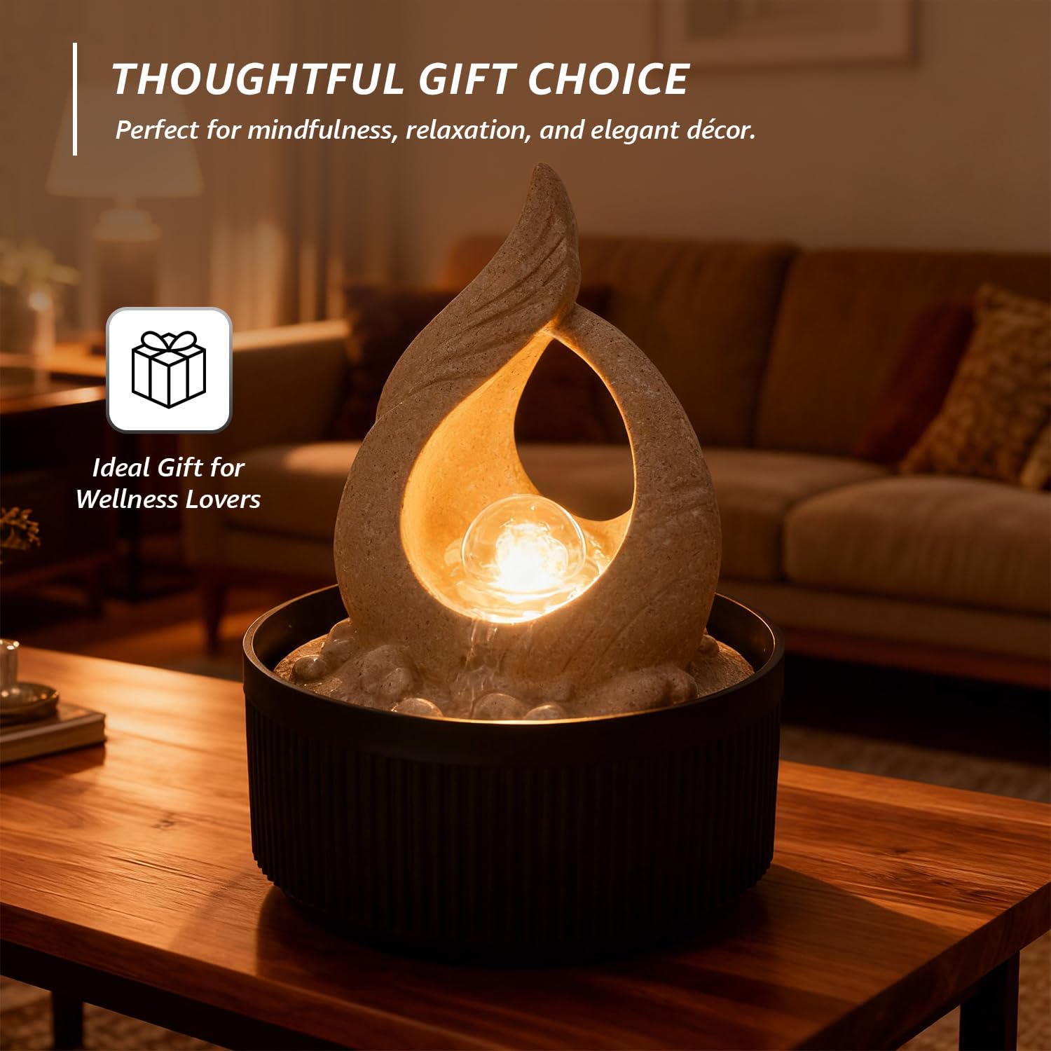 Night view of Amazon Basics Tabletop Fountain showing the glowing LED effect